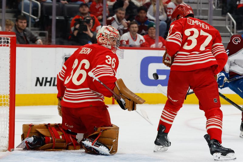 Jan 31, 2026; Detroit, Michigan, USA;  Detroit Red Wings goaltender John Gibson (36) makes a save in front of left wing J.T. Compher (37) in the first period against the Colorado Avalanche at Little Caesars Arena. Mandatory Credit: Rick Osentoski-Imagn Images