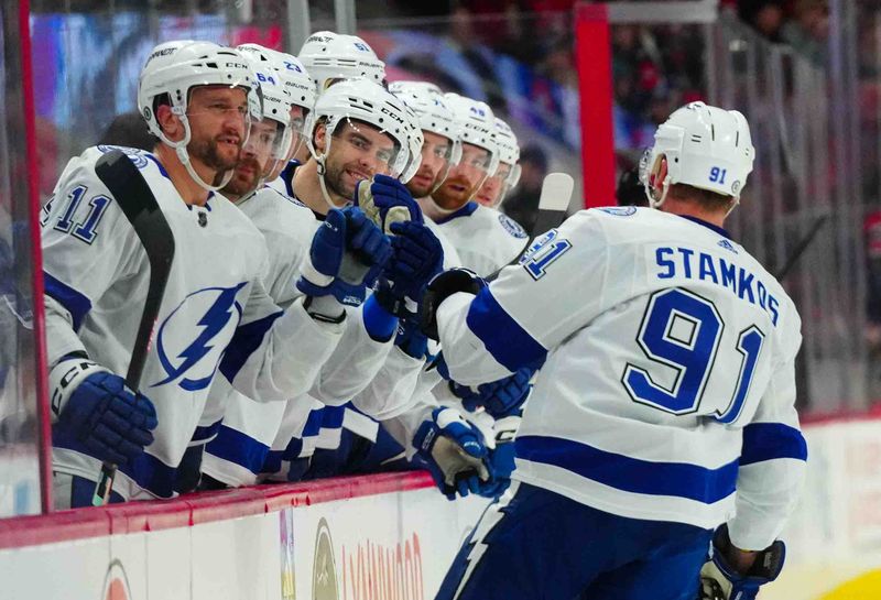 Nov 24, 2023; Raleigh, North Carolina, USA; Tampa Bay Lightning center Steven Stamkos (91) scores a goal against the Carolina Hurricanes during the second period at PNC Arena. Mandatory Credit: James Guillory-USA TODAY Sports