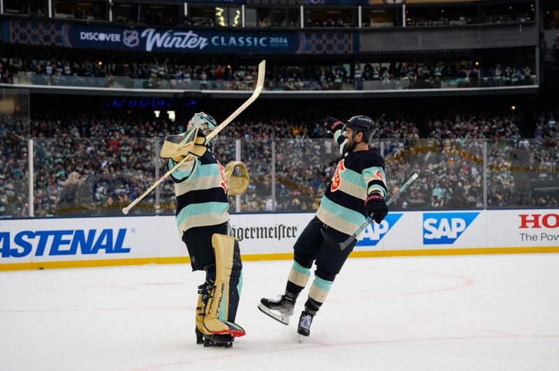 Jan 1, 2024; Seattle, Washington, USA; Seattle Kraken goaltender Joey Daccord (35) and Seattle Kraken defenseman Justin Schultz (4) celebrate defeating the Vegas Golden Knights in the 2024 Winter Classic ice hockey game at T-Mobile Park. Mandatory Credit: Steven Bisig-USA TODAY Sports