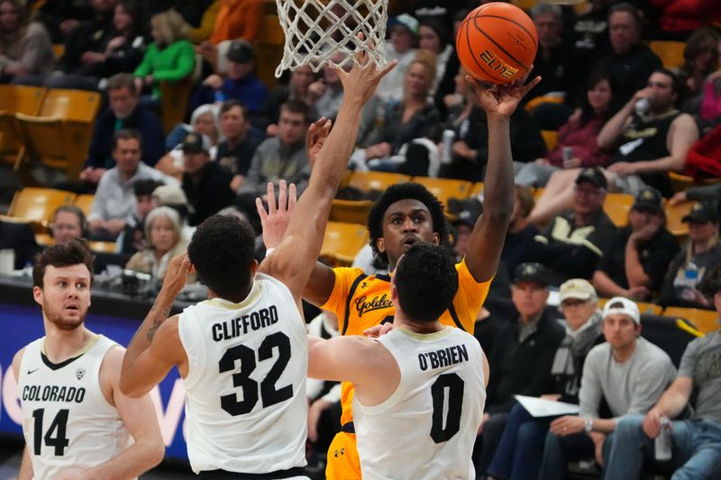 Feb 2, 2023; Boulder, Colorado, USA; California Golden Bears guard Marsalis Roberson (0) shoots past Colorado Buffaloes guard Luke O'Brien (0) and guard Nique Clifford (32) in the first half at the CU Events Center. Mandatory Credit: Ron Chenoy-USA TODAY Sports