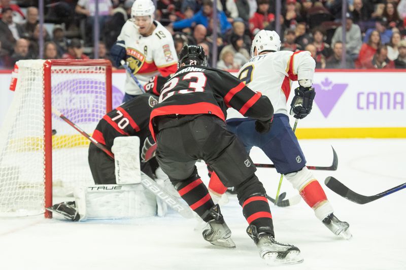 Nov 27, 2023; Ottawa, Ontario, CAN; Florida Panthers center Sam Bennett (9) scores against Ottawa Senators goalie Joonas Korpisalo (70) in the second period at the Canadian Tire Centre. Mandatory Credit: Marc DesRosiers-USA TODAY Sports