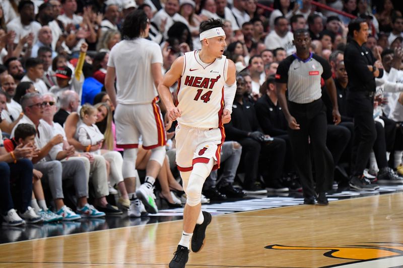 MIAMI, FL - APRIL 27: Tyler Herro #14 of the Miami Heat looks on during the gameagainst the Boston Celtics during Round 1 Game 3 of the 2024 NBA Playoffs on April 27, 2024 at Kaseya Center in Miami, Florida. NOTE TO USER: User expressly acknowledges and agrees that, by downloading and or using this Photograph, user is consenting to the terms and conditions of the Getty Images License Agreement. Mandatory Copyright Notice: Copyright 2024 NBAE (Photo by Brian Babineau/NBAE via Getty Images)