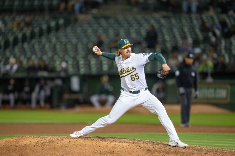 Aug 5, 2024; Oakland, California, USA;  Oakland Athletics relief pitcher Tyler Ferguson (65) delivers a pitch against the Chicago White Sox during the ninth inning  at Oakland-Alameda County Coliseum. Mandatory Credit: Neville E. Guard-USA TODAY Sports