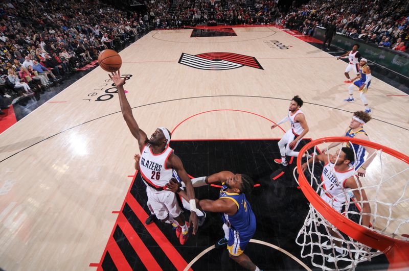 PORTLAND, OR - APRIL 11:  Duop Reath #26 of the Portland Trail Blazers grabs the rebound during the game on April 11, 2024 at the Moda Center Arena in Portland, Oregon. NOTE TO USER: User expressly acknowledges and agrees that, by downloading and or using this photograph, user is consenting to the terms and conditions of the Getty Images License Agreement. Mandatory Copyright Notice: Copyright 2024 NBAE (Photo by Cameron Browne/NBAE via Getty Images)