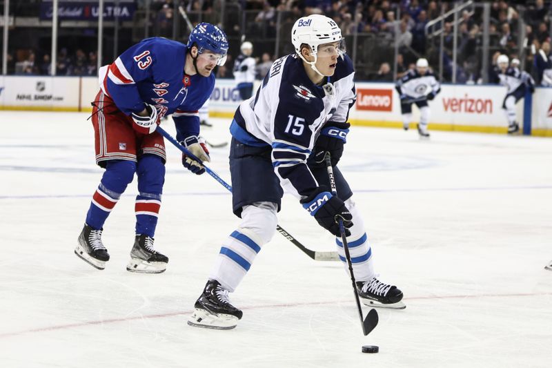 Nov 12, 2024; New York, New York, USA;  Winnipeg Jets center Rasmus Kupari (15) controls the puck in the third period against the New York Rangers at Madison Square Garden. Mandatory Credit: Wendell Cruz-Imagn Images