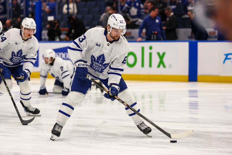 Feb 25, 2026; Tampa, Florida, USA; Toronto Maple Leafs forward Matias Maccelli (63) handles the puck during warm ups before the game against the Tampa Bay Lightning at Benchmark International Arena. Mandatory Credit: Morgan Tencza-Imagn Images