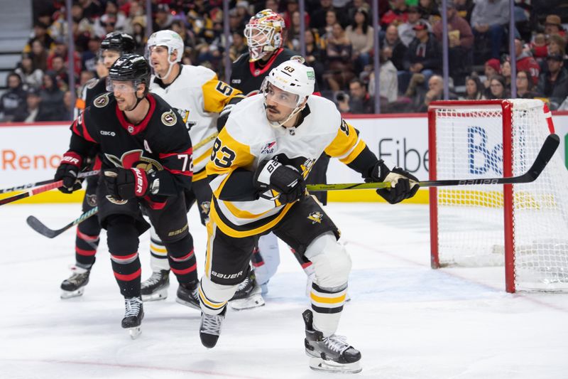 Dec 14, 2024; Ottawa, Ontario, CAN; Pittsburgh Penguins left wing Matt Nieto (83) follows the puck in the second period against the Ottawa Senators at the Canadian Tire Centre. Mandatory Credit: Marc DesRosiers-Imagn Images