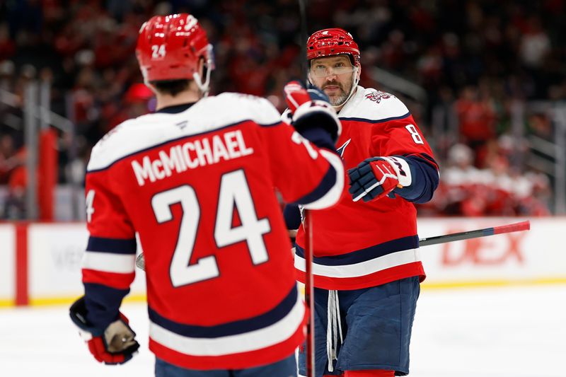 Jan 7, 2026; Washington, District of Columbia, USA; Washington Capitals left wing Alex Ovechkin (8) celebrates with Capitals center Connor McMichael (24) after scoring a goal against the Dallas Stars during the third period at Capital One Arena. Mandatory Credit: Geoff Burke-Imagn Images
