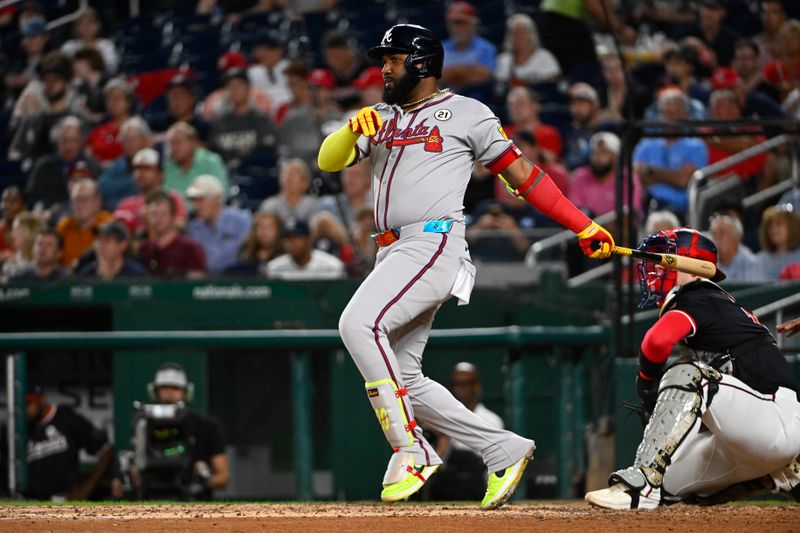 Sep 15, 2025; Washington, District of Columbia, USA; Atlanta Braves designated hitter Marcell Ozuna (20) singles against the Washington Nationals during the fifth inning at Nationals Park. Mandatory Credit: Brad Mills-Imagn Images