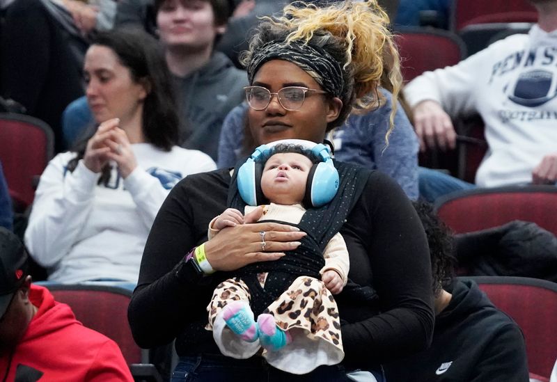 Mar 11, 2023; Chicago, IL, USA; Two Penn State Nittany Lions fans during the second half of their game against the Indiana Hoosiers at United Center. Mandatory Credit: David Banks-USA TODAY Sports