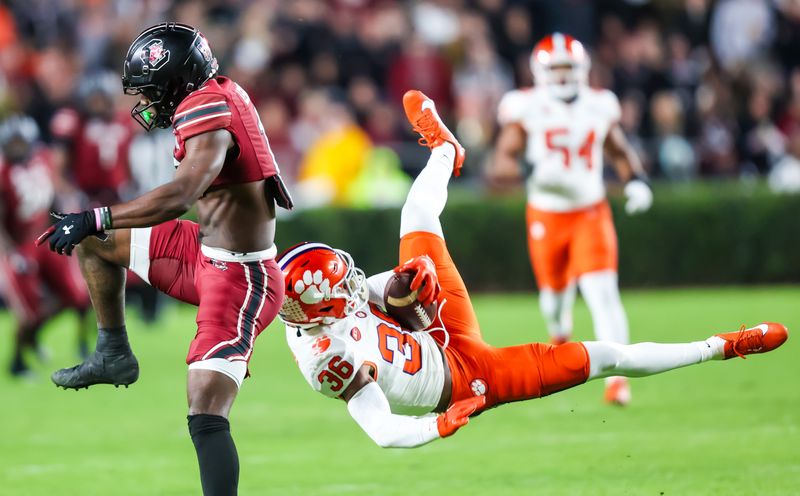 Nov 25, 2023; Columbia, South Carolina, USA; Clemson Tigers safety Khalil Barnes (36) intercepts a pass intended for South Carolina Gamecocks wide receiver Xavier Legette (17) in the first quarter at Williams-Brice Stadium. Mandatory Credit: Jeff Blake-USA TODAY Sports