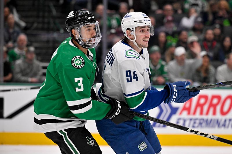 Jan 31, 2025; Dallas, Texas, USA; Dallas Stars defenseman Matt Dumba (3) and Vancouver Canucks center Linus Karlsson (94) look for the puck in the Stars zone during the third period at the American Airlines Center. Mandatory Credit: Jerome Miron-Imagn Images