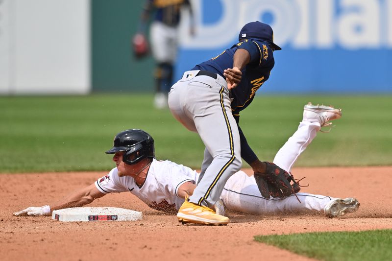 Jun 25, 2023; Cleveland, Ohio, USA; Cleveland Guardians center fielder Myles Straw (7) is caught stealing by Milwaukee Brewers second baseman Andruw Monasterio (14) during the eighth inning at Progressive Field. Mandatory Credit: Ken Blaze-USA TODAY Sports