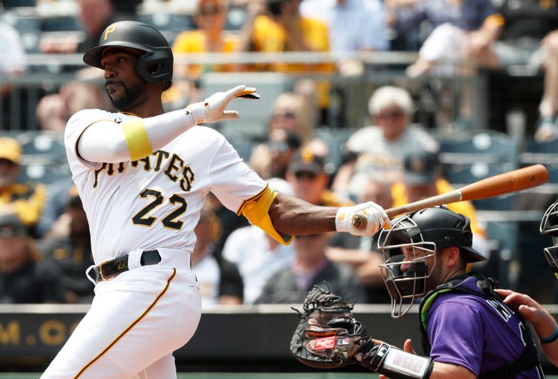 May 10, 2023; Pittsburgh, Pennsylvania, USA;  Pittsburgh Pirates designated hitter Andrew McCutchen (22) hits a two run home run against the Colorado Rockies during the third inning at PNC Park. Mandatory Credit: Charles LeClaire-USA TODAY Sports