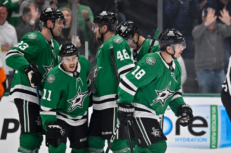 Nov 7, 2024; Dallas, Texas, USA; Dallas Stars center Sam Steel (18) and center Logan Stankoven (11) and defenseman Esa Lindell (23) and defenseman Ilya Lyubushkin (46) and center Wyatt Johnston (53) celebrates a goal scored by Steel against the Chicago Blackhawks during the first period at the American Airlines Center. Mandatory Credit: Jerome Miron-Imagn Images