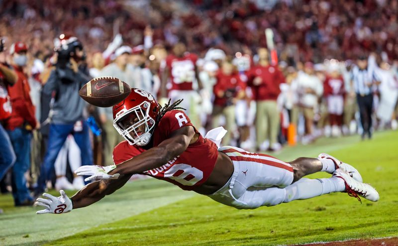 Oct 16, 2021; Norman, Oklahoma, USA;  Oklahoma Sooners wide receiver Michael Woods II (8) dives for but cannot make a catch during the game against the TCU Horned Frogs at Gaylord Family-Oklahoma Memorial Stadium. Mandatory Credit: Kevin Jairaj-USA TODAY Sports