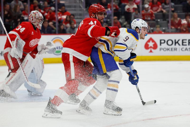 Apr 7, 2024; Detroit, Michigan, USA; Detroit Red Wings defenseman Shayne Gostisbehere (41) and Buffalo Sabres left wing Zach Benson (9) fight for position in the third period at Little Caesars Arena. Mandatory Credit: Rick Osentoski-USA TODAY Sports