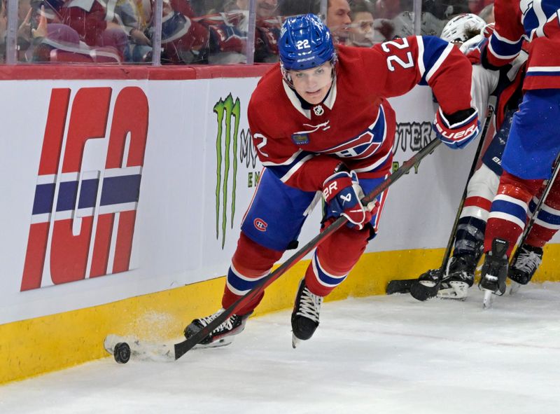 Feb 17, 2024; Montreal, Quebec, CAN; Montreal Canadiens forward Cole Caufield (22) plays the puck against the Washington Capitals during the third period at the Bell Centre. Mandatory Credit: Eric Bolte-USA TODAY Sports