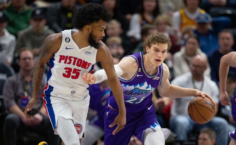 SALT LAKE CITY UT- NOVEMBER 23:  Lauri Markkanen #23 of the Utah Jazz pushes pasat Marvin Bagley III #35 of the Detroit Pistons during the first half of their game November 23, 2022  at the Vivint Arena in Salt Lake City, Utah. NOTE TO USER: User expressly acknowledges and agrees that, by downloading and using this photograph, User is consenting to the terms and conditions of the Getty Images License Agreement (Photo by Chris Gardner/ Getty Images)