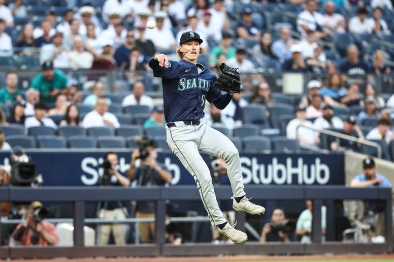 May 22, 2024; Bronx, New York, USA;  Seattle Mariners starting pitcher Bryce Miller (50) attempts to throw a runner out in the first inning against the New York Yankees at Yankee Stadium. Mandatory Credit: Wendell Cruz-USA TODAY Sports