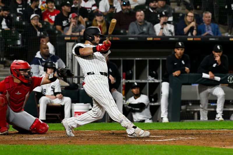 Sep 25, 2024; Chicago, Illinois, USA;  Chicago White Sox outfielder Andrew Benintendi (23) hits a walk off RBI single in the tenth inning against the Los Angeles Angels at Guaranteed Rate Field. . Mandatory Credit: Matt Marton-Imagn Images