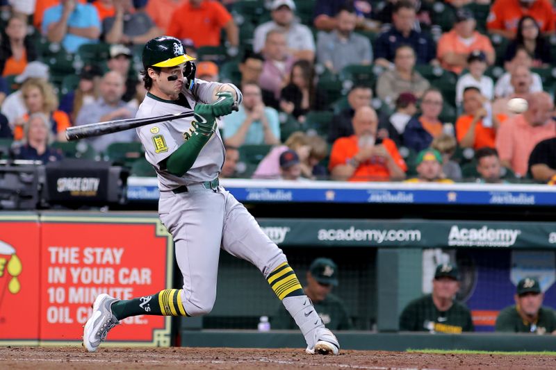 May 28, 2025; Houston, Texas, USA;  Athletics shortstop Jacob Wilson (5) hits a home run to left field against the Houston Astros during the fifth inning at Daikin Park. Mandatory Credit: Erik Williams-Imagn Images