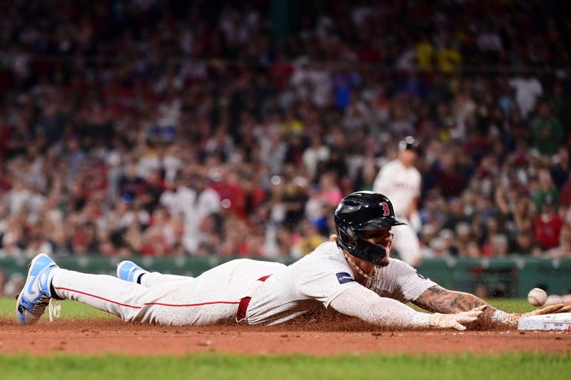 iJun 16, 2024; Boston, Massachusetts, USA; Boston Red Sox left fielder Jarren Duran (16) slides into third base during the seventh inning against the New York Yankees at Fenway Park. Mandatory Credit: Eric Canha-USA TODAY Sports