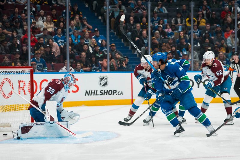Nov 9, 2025; Vancouver, British Columbia, CAN; Vancouver Canucks forward Kiefer Sherwood (44) scores on Colorado Avalanche goalie Mackenzie Blackwood (39) in the second period at Rogers Arena. Mandatory Credit: Bob Frid-Imagn Images