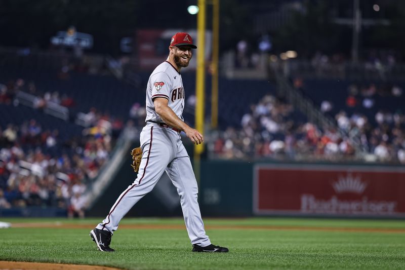 Jun 7, 2023; Washington, District of Columbia, USA; Arizona Diamondbacks relief pitcher Austin Adams (55) reacts after fielding a hit to retire Washington Nationals center fielder Alex Call (17) during the seventh inning at Nationals Park. Mandatory Credit: Scott Taetsch-USA TODAY Sports