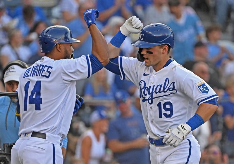 Jul 29, 2023; Kansas City, Missouri, USA;  Kansas City Royals second baseman Michael Massey (19) celebrates with Edward Olivares (14) after hitting a solo home run during the second inning against the Minnesota Twins at Kauffman Stadium. Mandatory Credit: Peter Aiken-USA TODAY Sports