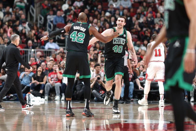 CHICAGO, IL - FEBRUARY 22: Al Horford #42 of the Boston Celtics and Luke Kornet #40 of the Boston Celtics high fives during the game against the Chicago Bulls on February 22, 2024 at United Center in Chicago, Illinois. NOTE TO USER: User expressly acknowledges and agrees that, by downloading and or using this photograph, User is consenting to the terms and conditions of the Getty Images License Agreement. Mandatory Copyright Notice: Copyright 2024 NBAE (Photo by Jeff Haynes/NBAE via Getty Images)