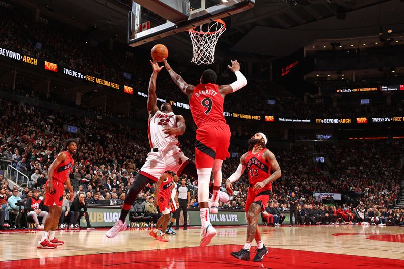 TORONTO, CANADA - JANUARY 17: Jimmy Butler #22 of the Miami Heat drives to the basket during the game against the Toronto Raptors on January 17, 2024 at the Scotiabank Arena in Toronto, Ontario, Canada.  NOTE TO USER: User expressly acknowledges and agrees that, by downloading and or using this Photograph, user is consenting to the terms and conditions of the Getty Images License Agreement.  Mandatory Copyright Notice: Copyright 2024 NBAE (Photo by Vaughn Ridley/NBAE via Getty Images)