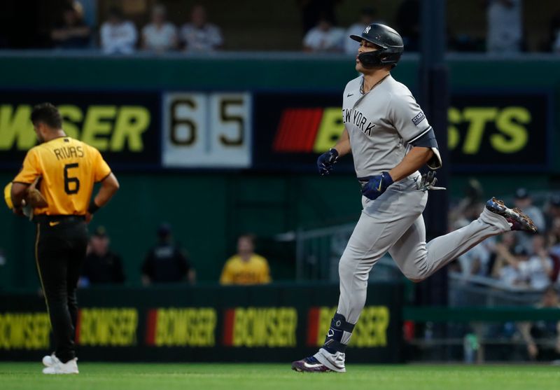 Sep 16, 2023; Pittsburgh, Pennsylvania, USA; New York Yankees designated hitter Giancarlo Stanton (27) circles the bases on a solo home run against the Pittsburgh Pirates during the third inning at PNC Park. Mandatory Credit: Charles LeClaire-USA TODAY Sports