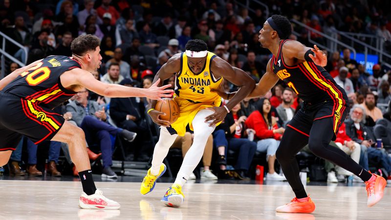 ATLANTA, GEORGIA - MARCH 6: Pascal Siakam #43 of the Indiana Pacers drives to the basket between Georges Niang #20 and Onyeka Okongwu #17 of the Atlanta Hawks during the third quarter at State Farm Arena on March 6, 2025 in Atlanta, Georgia. NOTE TO USER: User expressly acknowledges and agrees that, by downloading and or using this photograph, User is consenting to the terms and conditions of the Getty Images License Agreement. (Photo by Todd Kirkland/Getty Images)