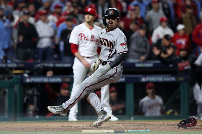 Oct 24, 2023; Philadelphia, Pennsylvania, USA; Arizona Diamondbacks left fielder Corbin Carroll (7) slides safety score a runagainst the Philadelphia Phillies  in the fifth inning for game seven of the NLCS for the 2023 MLB playoffs at Citizens Bank Park. Mandatory Credit: Bill Streicher-USA TODAY Sports