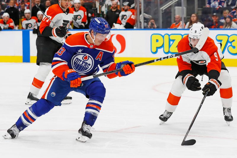 Oct 15, 2024; Edmonton, Alberta, CAN; Edmonton Oilers forward Ryan Nugent-Hopkins (93) gets a shot away in front of Philadelphia Flyers defensemen Jamie Drysdale (9) during the third period at Rogers Place. Mandatory Credit: Perry Nelson-Imagn Images