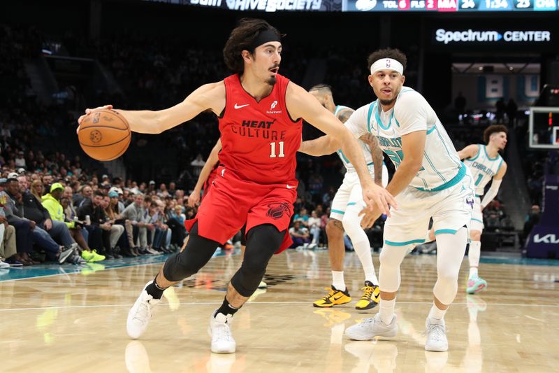 CHARLOTTE, NC - NOVEMBER 27:  Jaime Jaquez Jr. #11 of the Miami Heat dribbles the ball during the game against the Charlotte Hornets on November 27, 2024 at Spectrum Center in Charlotte, North Carolina. NOTE TO USER: User expressly acknowledges and agrees that, by downloading and or using this photograph, User is consenting to the terms and conditions of the Getty Images License Agreement. Mandatory Copyright Notice: Copyright 2024 NBAE (Photo by Brock Williams-Smith/NBAE via Getty Images)