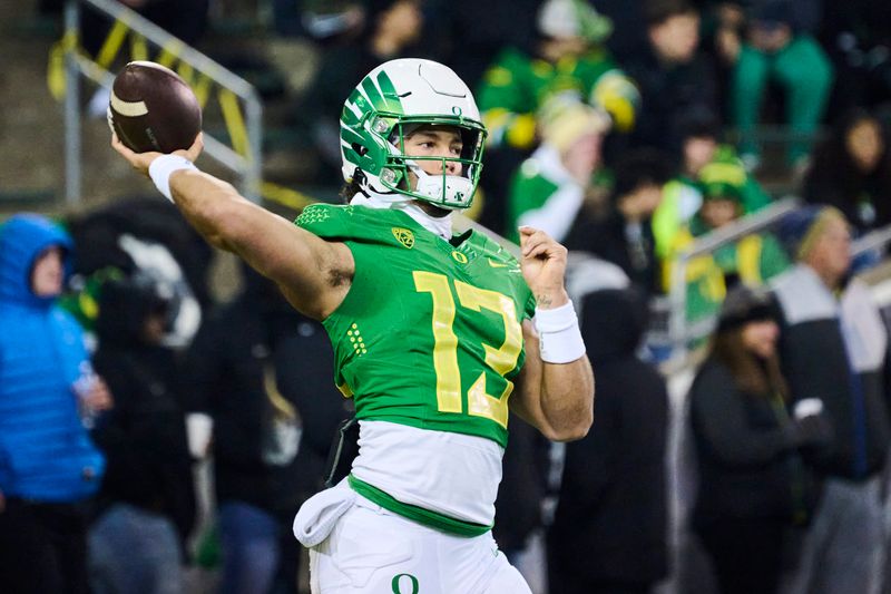 Nov 19, 2022; Eugene, Oregon, USA; Oregon Ducks quarterback Ty Thompson (13) throws a pass before a game against the Utah Utes at Autzen Stadium. Mandatory Credit: Troy Wayrynen-USA TODAY Sports