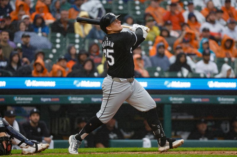 Sep 28, 2024; Detroit, Michigan, USA; Chicago White Sox first baseman Andrew Vaughn (25) hits against the Detroit Tigers during the fifth inning at Comerica Park. Mandatory Credit: Brian Bradshaw Sevald-Imagn Images