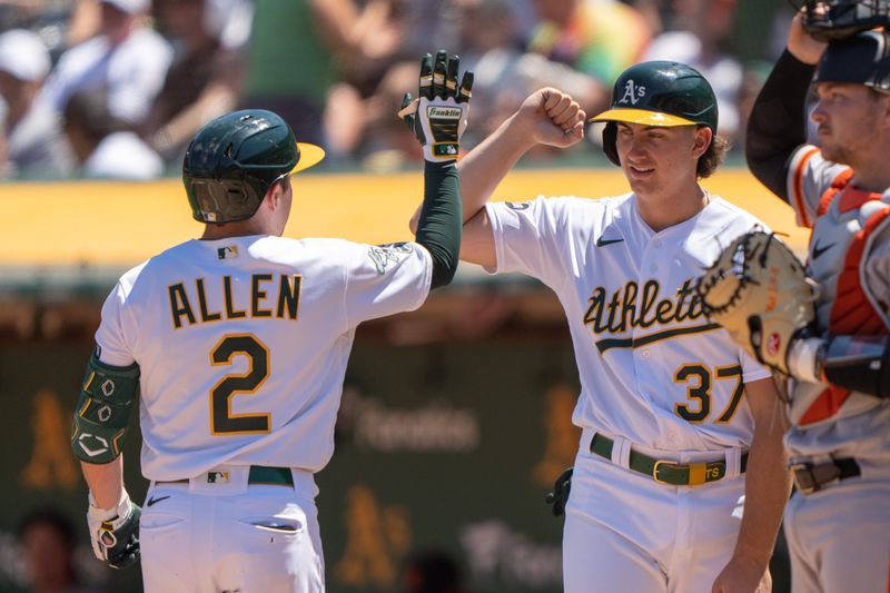 Aug 6, 2023; Oakland, California, USA;  Oakland Athletics shortstop Nick Allen (2) celebrates with catcher Tyler Soderstrom (37) after hitting a two-run home run during the second inning against the San Francisco Giants at Oakland-Alameda County Coliseum. Mandatory Credit: Stan Szeto-USA TODAY Sports