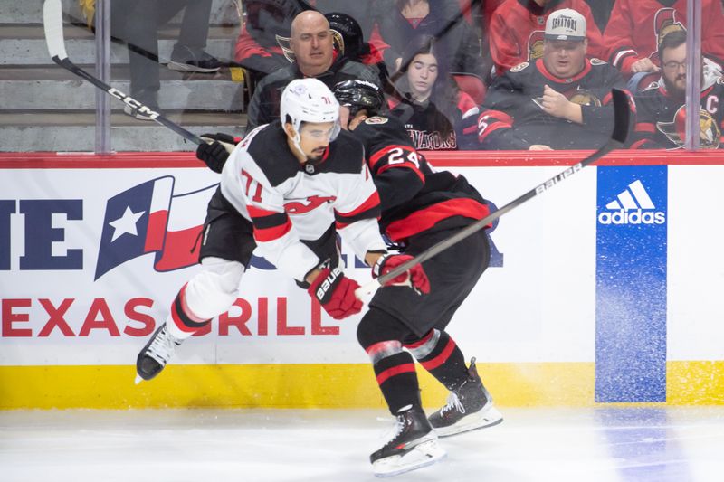 Apr 6, 2024; Ottawa, Ontario, CAN; New Jersey Devils defenseman Jonas Siegenthaler (71) is checked by Ottawa Senators defenseman Jacob bernard-Docker (24) in the third period at the Canadian Tire Centre. Mandatory Credit: Marc DesRosiers-USA TODAY Sports