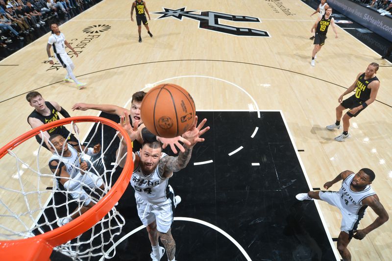 SAN ANTONIO, TX - OCTOBER 12: Sandro Mamukelashvili #54 of the San Antonio Spurs goes up for the rebound during the game against the Utah Jazz during a NBA pre season game on October 12, 2024 at the Frost Bank Center in San Antonio, Texas. NOTE TO USER: User expressly acknowledges and agrees that, by downloading and or using this photograph, user is consenting to the terms and conditions of the Getty Images License Agreement. Mandatory Copyright Notice: Copyright 2024 NBAE (Photos by Michael Gonzales/NBAE via Getty Images)