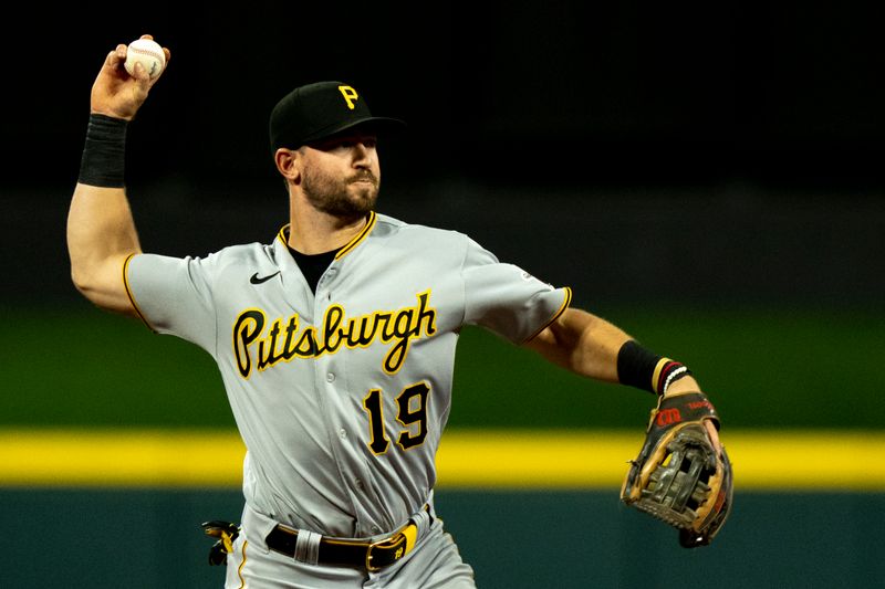 Sep 23, 2023; Cincinnati, Ohio, USA; Pittsburgh Pirates third baseman Jared Triolo (19) throws out Cincinnati Reds second baseman Jonathan India (6) at first in the fifth inning at Great American Ball Park. Mandatory Credit: The Cincinnati Enquirer-USA TODAY Sports