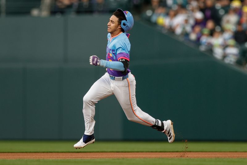 Jun 6, 2025; Denver, Colorado, USA; Colorado Rockies shortstop Ryan Ritter (8) loses his helmet as he runs the bases on a triple in the fifth inning against the New York Mets at Coors Field. Mandatory Credit: Isaiah J. Downing-Imagn Images