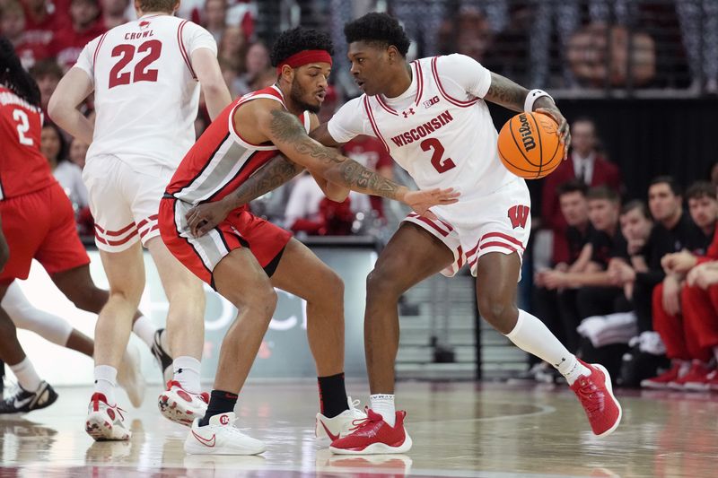 Feb 13, 2024; Madison, Wisconsin, USA;  Wisconsin Badgers guard AJ Storr (2) dribbles the ball against Ohio State Buckeyes guard Roddy Gayle Jr. (1) during the first half at the Kohl Center. Mandatory Credit: Kayla Wolf-USA TODAY Sports