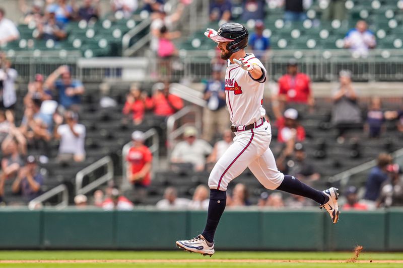 Sep 24, 2025; Cumberland, Georgia, USA; Atlanta Braves right fielder Eli White (36) runs and reacts after hitting a home run against the Washington Nationals during the ninth inning at Truist Park. Mandatory Credit: Dale Zanine-Imagn Images
