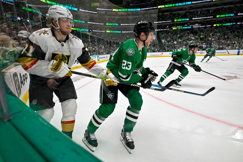 May 5, 2024; Dallas, Texas, USA; Vegas Golden Knights center William Karlsson (71) and Dallas Stars defenseman Esa Lindell (23) chase the puck in the Stars zone during the third period in game seven of the first round of the 2024 Stanley Cup Playoffs at American Airlines Center. Mandatory Credit: Jerome Miron-USA TODAY Sports