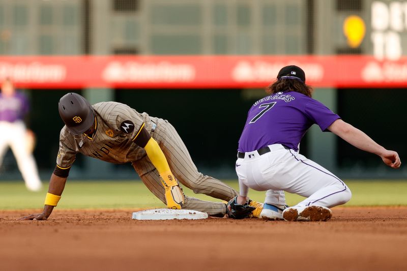 Apr 22, 2024; Denver, Colorado, USA; San Diego Padres left fielder Jose Azocar (28) steals second against Colorado Rockies second baseman Brendan Rodgers (7) in the third inning at Coors Field. Mandatory Credit: Isaiah J. Downing-USA TODAY Sports