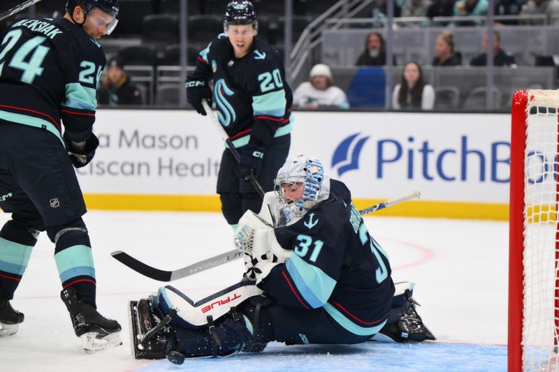 Nov 2, 2023; Seattle, Washington, USA; Seattle Kraken goaltender Philipp Grubauer (31) blocks a goal shot against the Nashville Predators during the second period at Climate Pledge Arena. Mandatory Credit: Steven Bisig-USA TODAY Sports