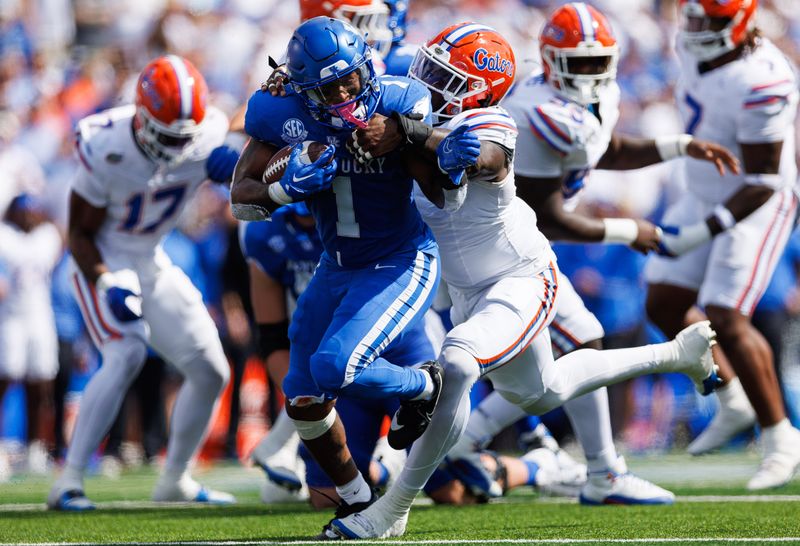 Sep 30, 2023; Lexington, Kentucky, USA; Kentucky Wildcats running back Ray Davis (1) carries the ball during the second quarter against the Florida Gators at Kroger Field. Mandatory Credit: Jordan Prather-USA TODAY Sports